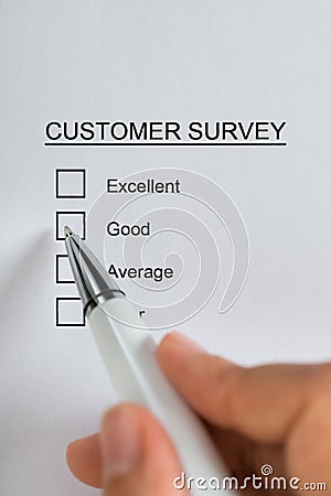 Person Hands Filling Customer Survey Form Stock Photo