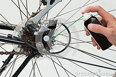 Person Hands Lubricating Bike Stock Photo