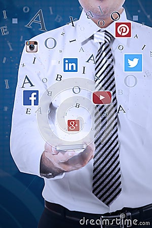 Person holding cellphone with social network icons Editorial Stock Photo