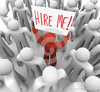 Person Holding Hire Me Sign in Crowd Stock Photo