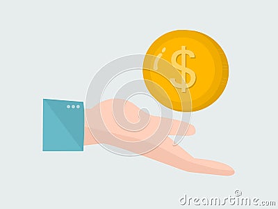 Person holding a large gold colored money coin on a blue background Stock Photo