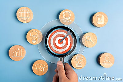 Person holding a magnifying glass focus business growth success achievement concept, customer target group concept Stock Photo