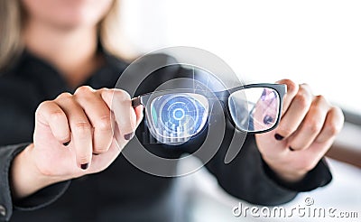 Person holding nanotech smart glasses. Eyewear with interactive augmented reality. Stock Photo