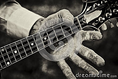 Person Holding Neck of a Mandolin Stock Photo
