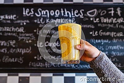 Person holds freshly prepared smoothie Stock Photo