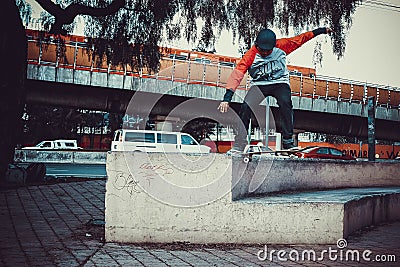 Person jumping with skateboard in school Editorial Stock Photo