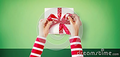 Person making a Christmas gift box Stock Photo