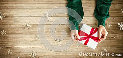 Person making a Christmas gift box Stock Photo