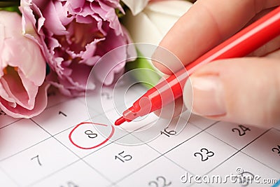 Person marking date 8th of March in calendar, closeup. International Women`s Day Stock Photo