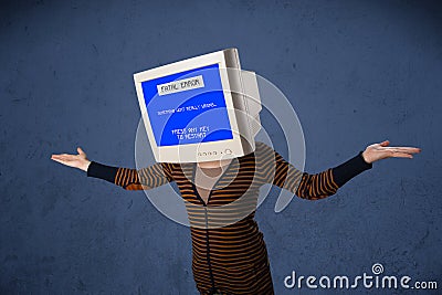 Person with a monitor head and fatal error blue screen on the di Stock Photo