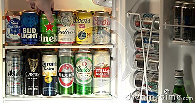 A person opening a hotel fridge with beer. Fridge interior, mini bar with domestic and imported beers from around the world, in. Calgary, Alberta, Canada. Jun 9 stock video A person opening a hotel fridge with beer. Fridge interior, mini bar with domestic and imported beers from around the world, in. Calgary, Alberta, Canada. Jun 9 stock video