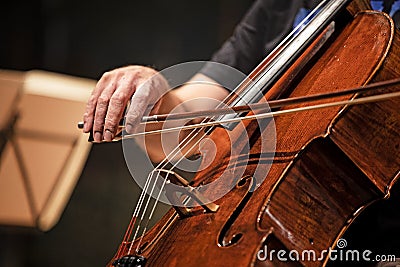 Person playing chello at a concert Stock Photo