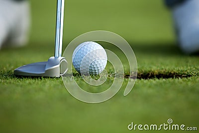 Person playing golf, low section Stock Photo