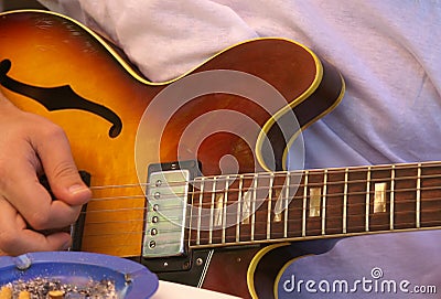 Person playing guitar Stock Photo
