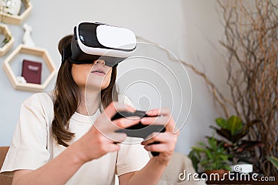 A person plays a joystick in a game of virotic reality. Cyber gaming Stock Photo