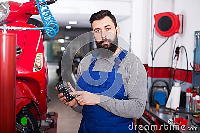 Person is preparing bill for motorcycle repair Stock Photo