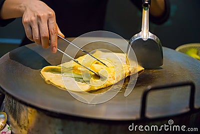 Person Preparing Pineapple Pancake At Market Stall Stock Photo