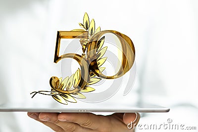 Person presenting a virtual projection of the digital number fifty Stock Photo