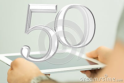 Person presenting a virtual projection of the digital number fifty Stock Photo