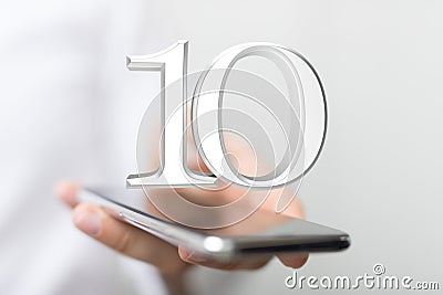 Person presenting a virtual projection of the digital number ten Stock Photo