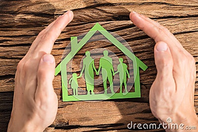 Person Protecting Family Home Stock Photo