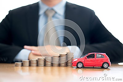 Person Protecting Increasing Stacked Coins And Car Stock Photo