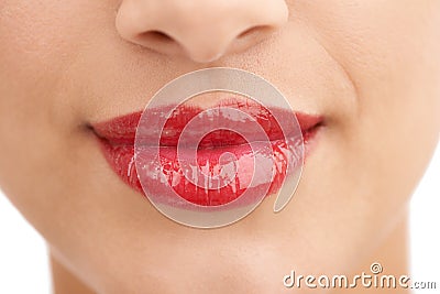 Person, red lipstick and closeup of smile with makeup in cosmetics, gloss or glow in treatment. Colorful lips of woman Stock Photo