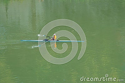 A person rowing boat on tiber River, Rome, Italy Editorial Stock Photo