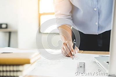 Person`s engineer Hand Drawing Plan On Blue Print with architect Stock Photo