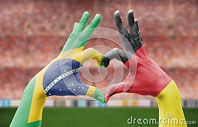Person`s hand forming a heart with the flags of Brazil and Germany - love towards football concept Stock Photo