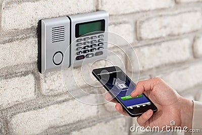 Hand Disarming Security System Of Door Stock Photo