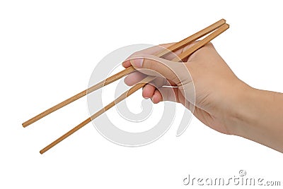 Person's right hand using bamboo chopsticks Stock Photo