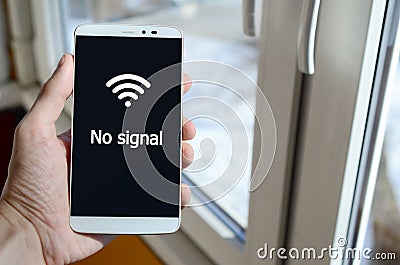 A person sees a white inscription on a black smartphone display Stock Photo