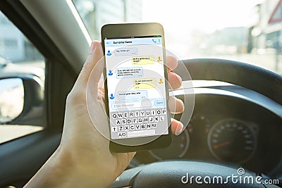 Person Sending Message Using Mobile Phone Stock Photo