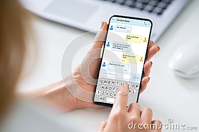 Person Sending Text Message From Smartphone Stock Photo