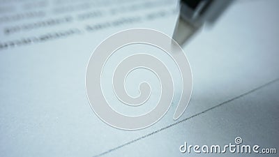Person signing document with pen. Ballpen making signature on business paper Stock Photo