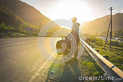 Person silhouette in the mountains with bicycle Stock Photo