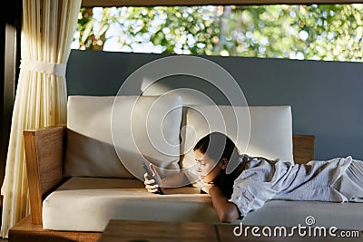 Person smartphone phone women mobile home female young Stock Photo
