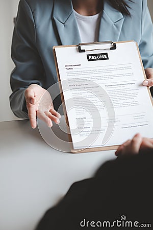 Person submitting resume to interview for a job with a company, Person attending a job interview with a manager to be recruited to Stock Photo