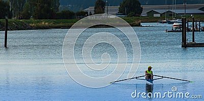 Person in rowing skull taking a break Editorial Stock Photo