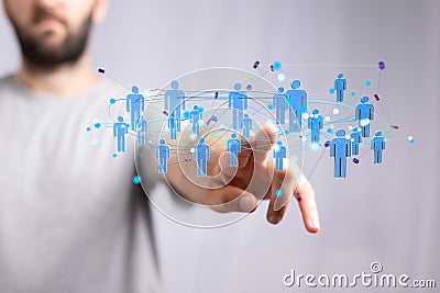 Person touching 3D rendered people icons Stock Photo