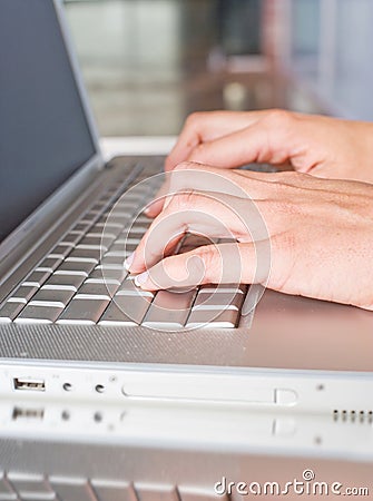 Person Typing on a modern laptop Stock Photo