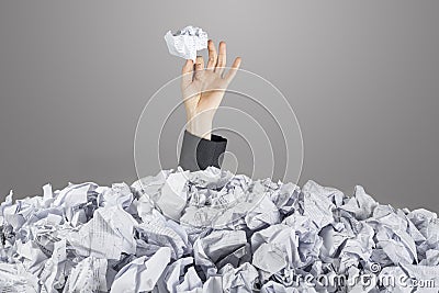 Person under pile of documents Stock Photo