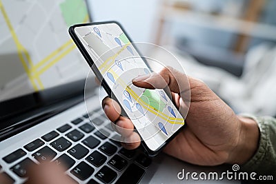 Person Using GPS Navigation Map On Mobile Phone Stock Photo