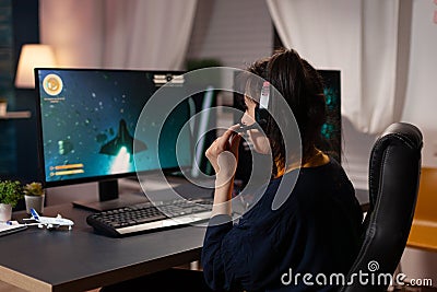 Person using headset to stream online video games Stock Photo