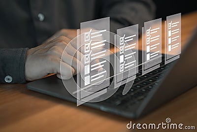 Person using a laptop, interacting with digital checklist displayed as floating icons on the screen. Stock Photo