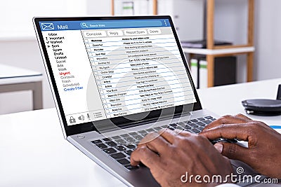 Woman Checking Mail Inbox On Laptop Stock Photo