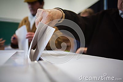 Person voting at polling station Stock Photo