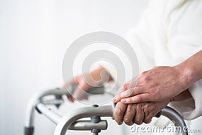 Person with walking aid Stock Photo