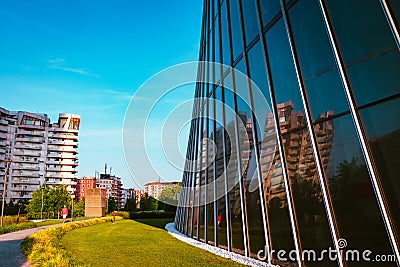 Person walking in front of skyscraper in the Citylife district of Milan Editorial Stock Photo